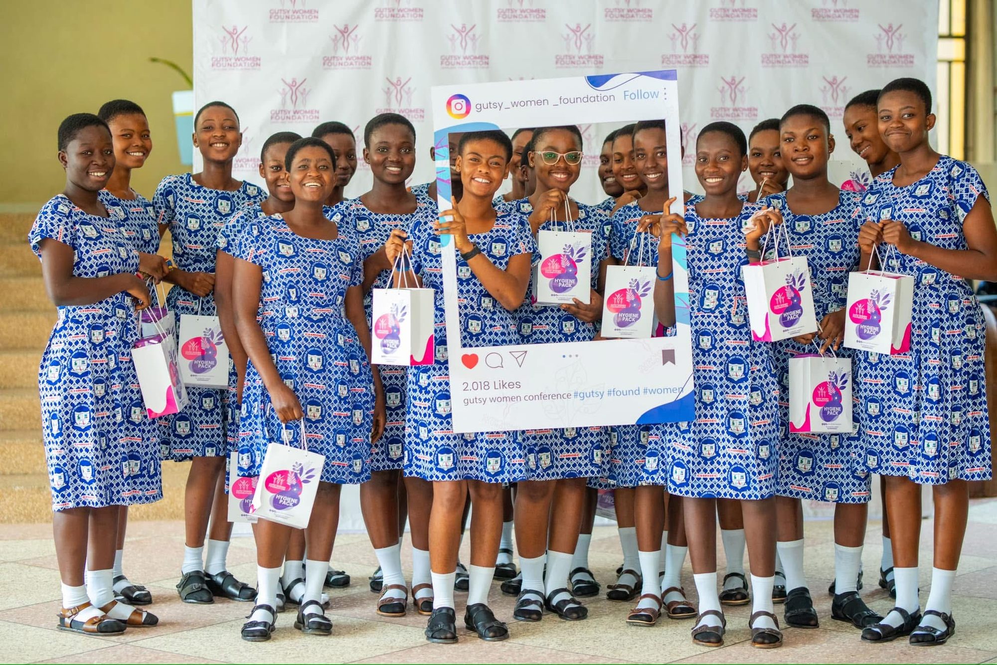 Students celebrating their GWF hygiene packs with Instagram frame